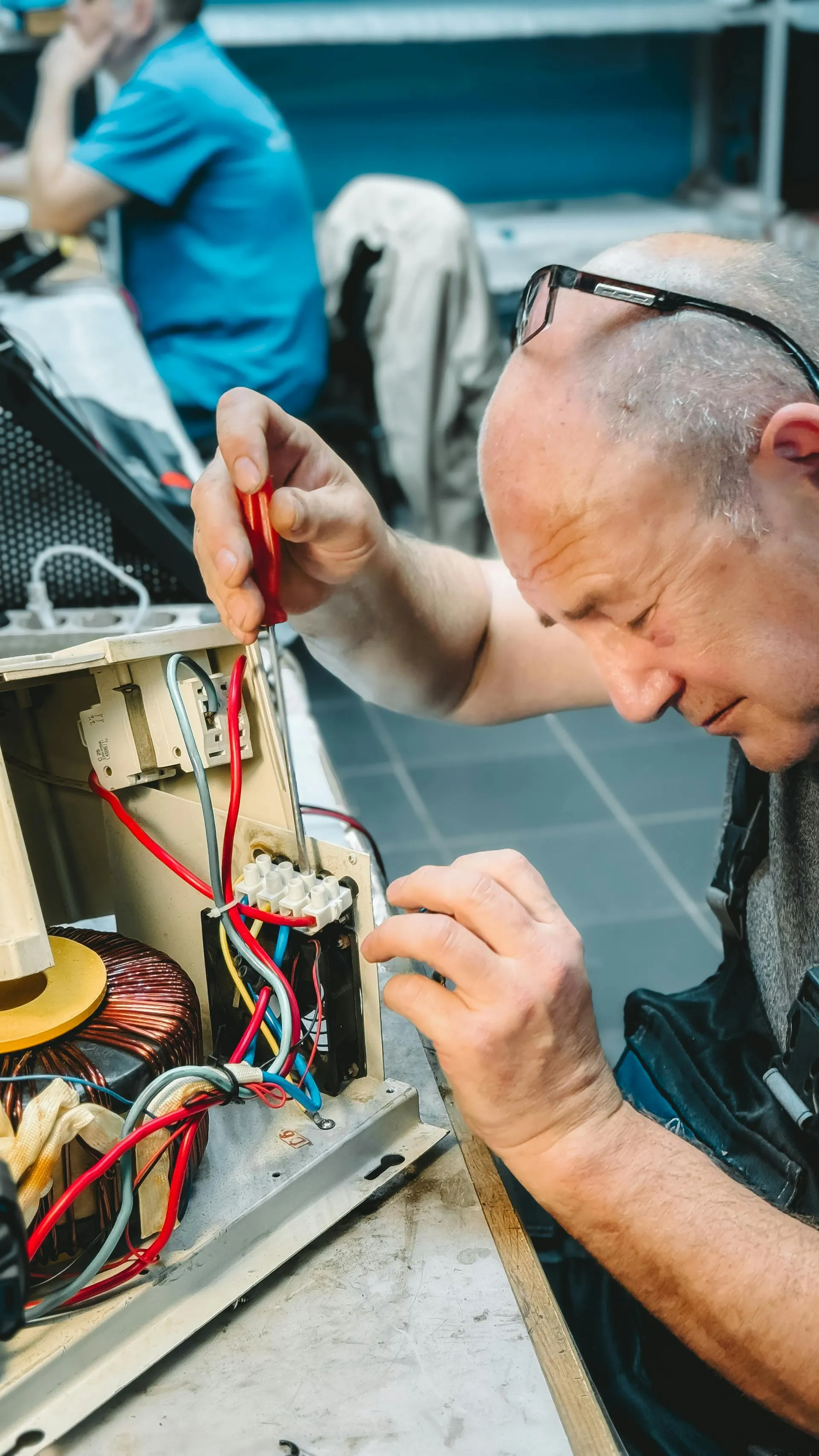 Certified electrician performing panel upgrade